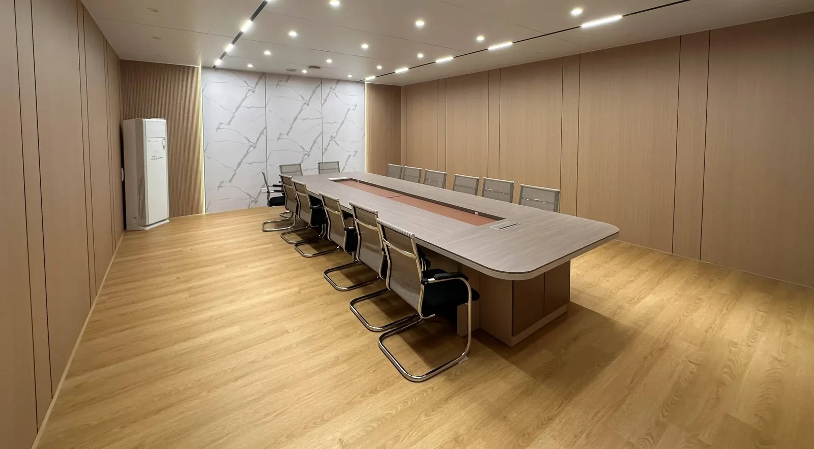 Meeting room with wood veneer wall system