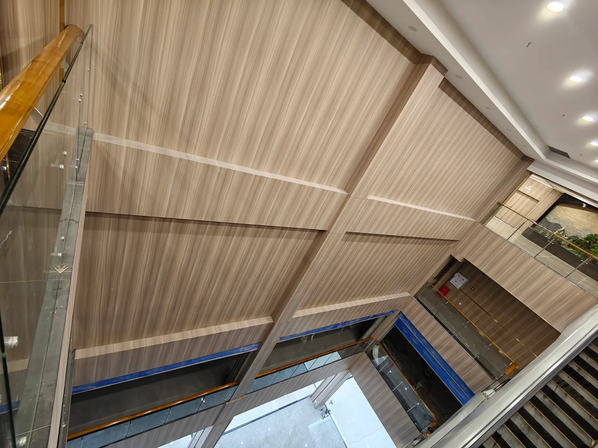 Commercial atrium with wood-grain wall panels